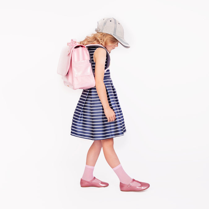 Girl wearing Jeune Premier It Bag Midi Blush school bag, age 6 to 8