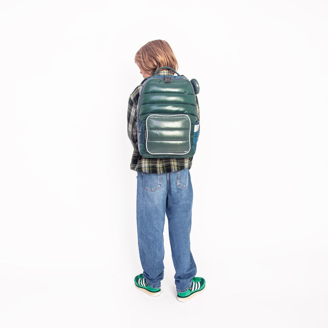 Boy wearing Jeune Premier New Bobbie Puffer Green school backpack, age 6 and up