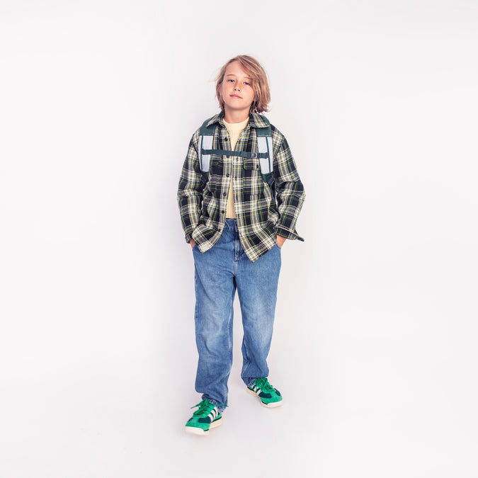 Boy wearing Jeune Premier New Bobbie Puffer Green school backpack, age 6 and up