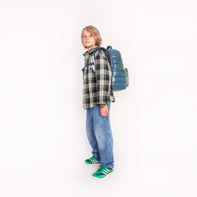 Boy wearing Jeune Premier New Bobbie Puffer Green school backpack, age 6 and up